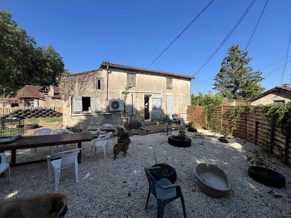 Maison sur 2 niveaux avec jardin, dépendance de 80 m2 et beaux volumes Fumel