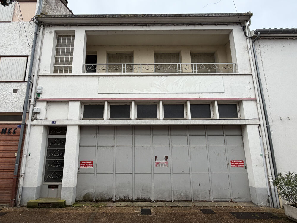 Maison de ville avec grand garage et cave