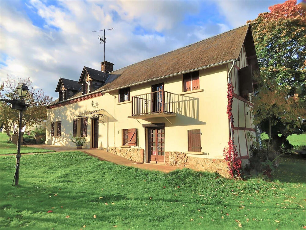 Une propriété comprenant : Une maison d'habitation offrant : - Au rez-de-chaussée : séjour avec cheminée, cuis