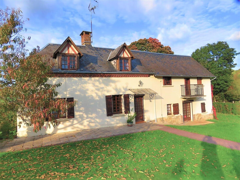 Une propriété comprenant : Une maison d'habitation offrant : - Au rez-de-chaussée : séjour avec cheminée, cuis