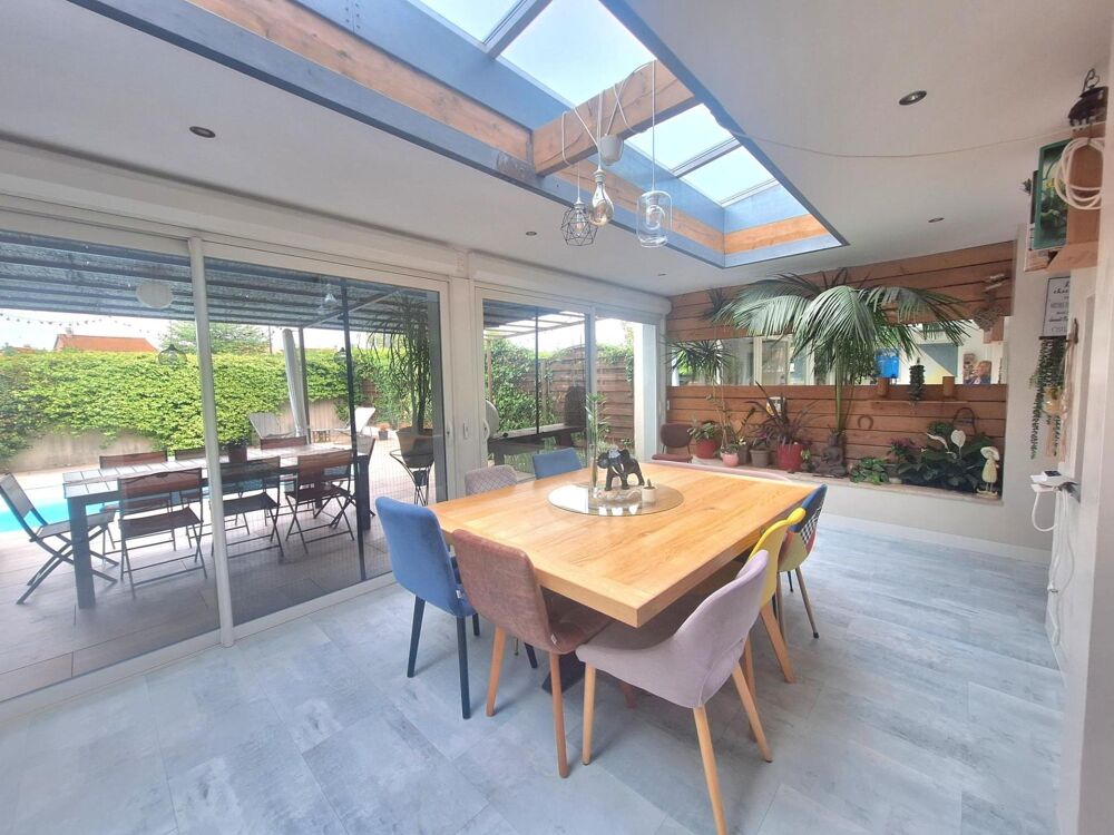 Vente Maison Charmante maison familiale, avec une pièce de vie chaleureuse au volume généreux, ouverte sur une véranda chauffée, véritable co Meyzieu
