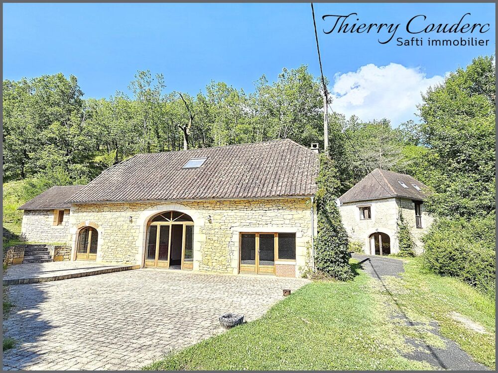 Maison en pierre avec gîte et piscine.