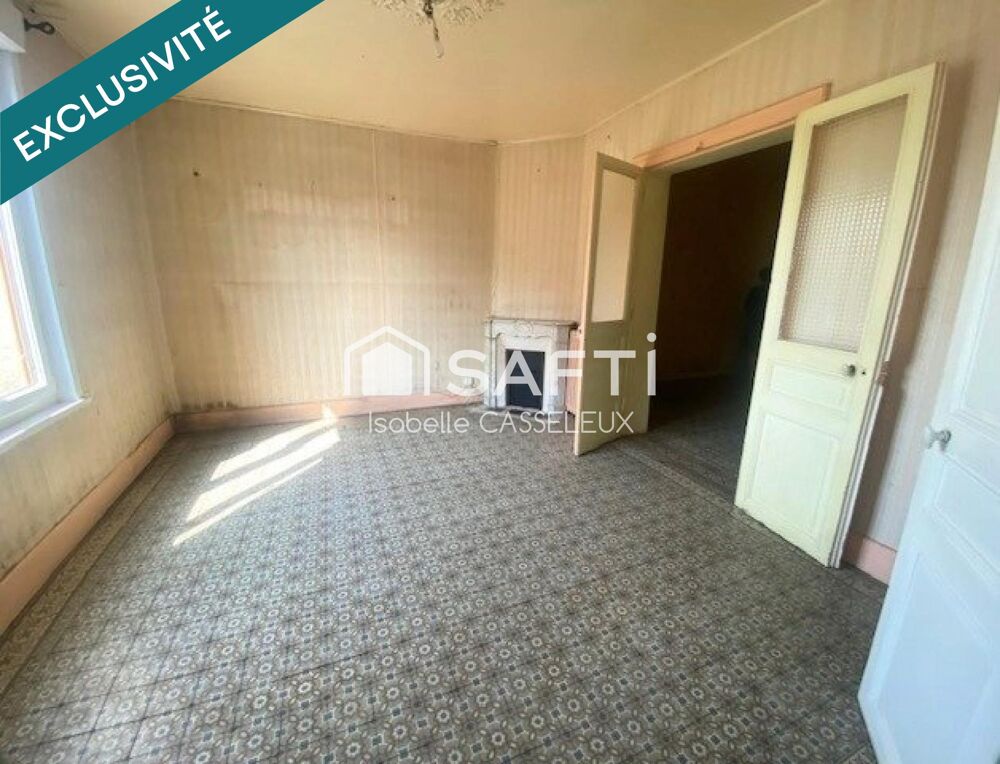 Maison de ville en briques de 110 m²  2 chambres, garage, dépendances et jardin à Guise