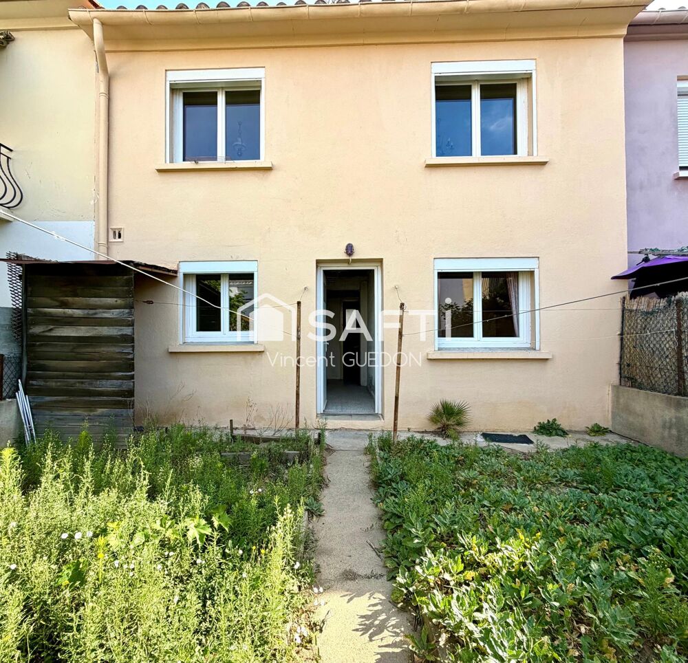 Maison avec garage et jardin clôturé