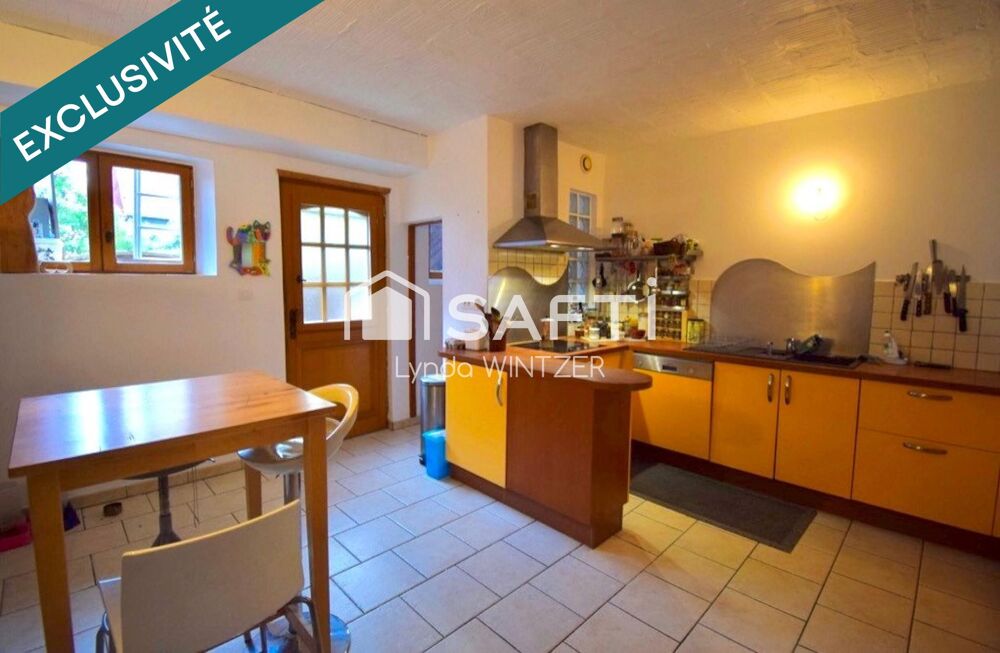 Maison familiale mitoyenne chaleureuse avec jardinet à Muttersholtz  120 m²  6 pièces