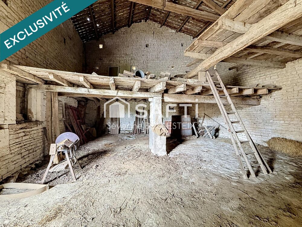 Maison en pierre avec grange attenante