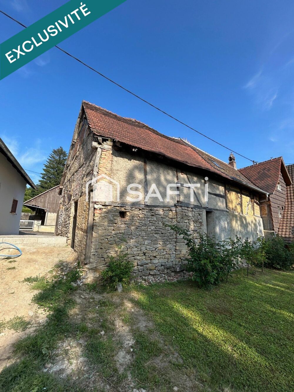 Grange de 90m² à réhabiliter entièrement au coeur de Walheim avec parking.
