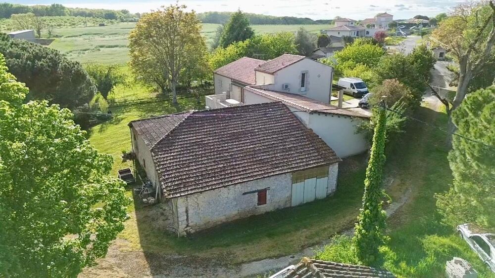 Ensemble immobilier idéalement situé entre Villeneuve-sur-Lot et Agen de nombreuses dépendances sur une parcelle de 2454m2