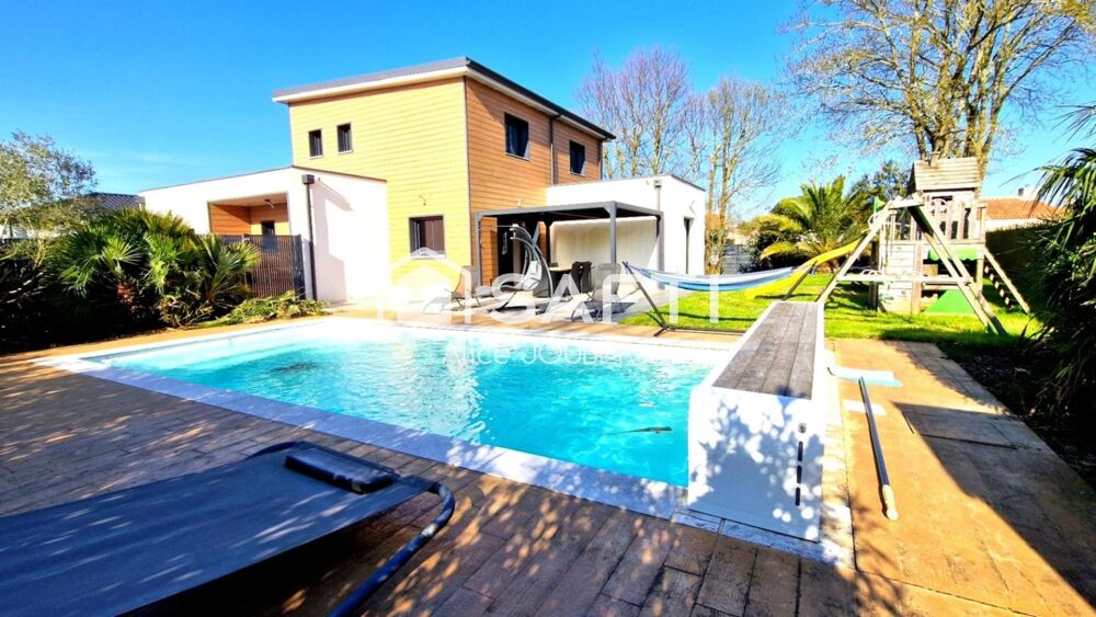 Maison 4 chambres, garage et piscine.