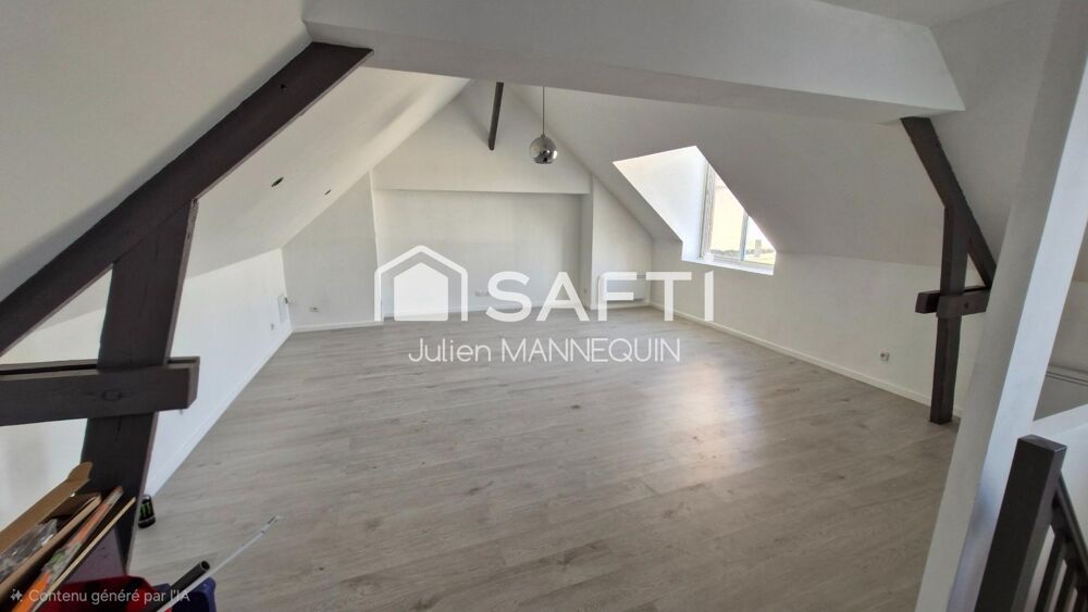 maison mitoyenne de 100 m2 , 2 chambres dont une suite parentale avec sa douche, cuisine ouverte sur le salon et accès a une ter