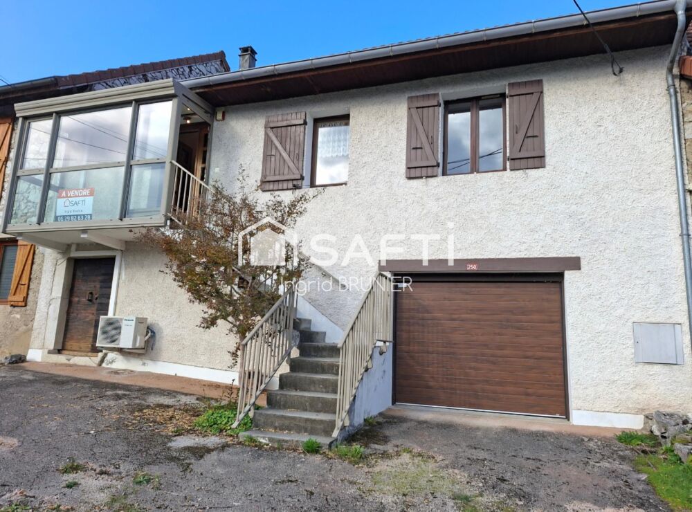 Maison en pierre avec terrain et un garage