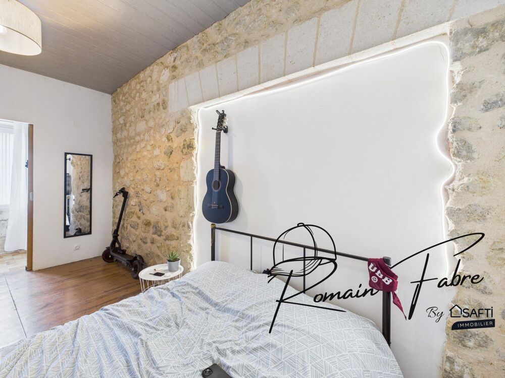 Maison en pierre avec 3 chambres , double garage et piscine semi-enterrée
