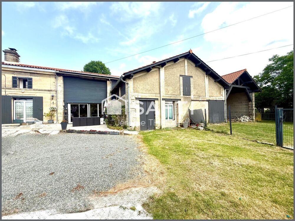 Grande maison de caractère avec nombreuses possibilités.