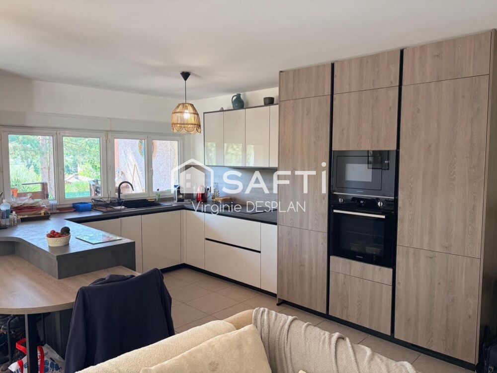 Appartement rez-de-jardin, 3 pièces avec terrasse, cave et place de parking privatives