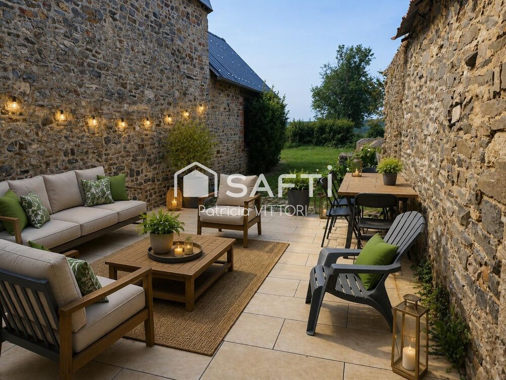 Maison en pierre avec terrasse, jardin et vue dégagée