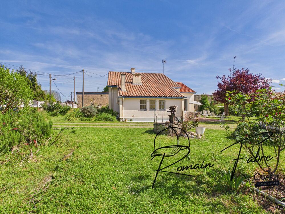 Maison plain pied de 4 chambres avec grand jardin et dépendances.