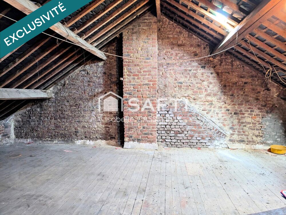 Maison de ville en briques de 110 m²  2 chambres, garage, dépendances et jardin à Guise