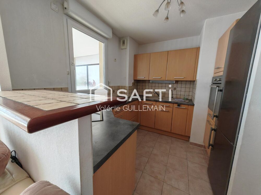 Appartement T4 de 77m² + double garage + place extérieure