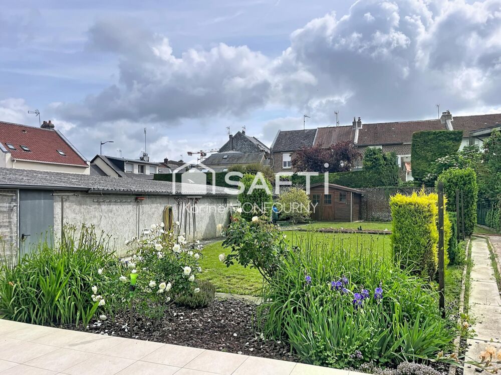 Maison avec cave, jardin et lot de garages