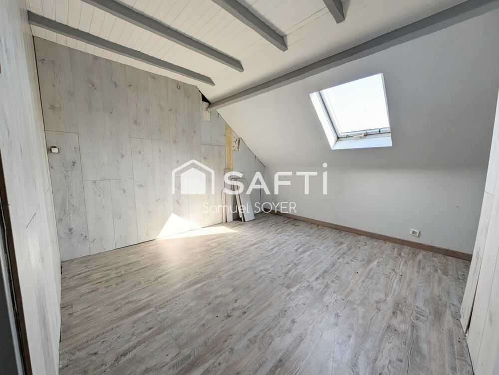 MAISON SEMI-MITOYENNE AVEC JARDIN
