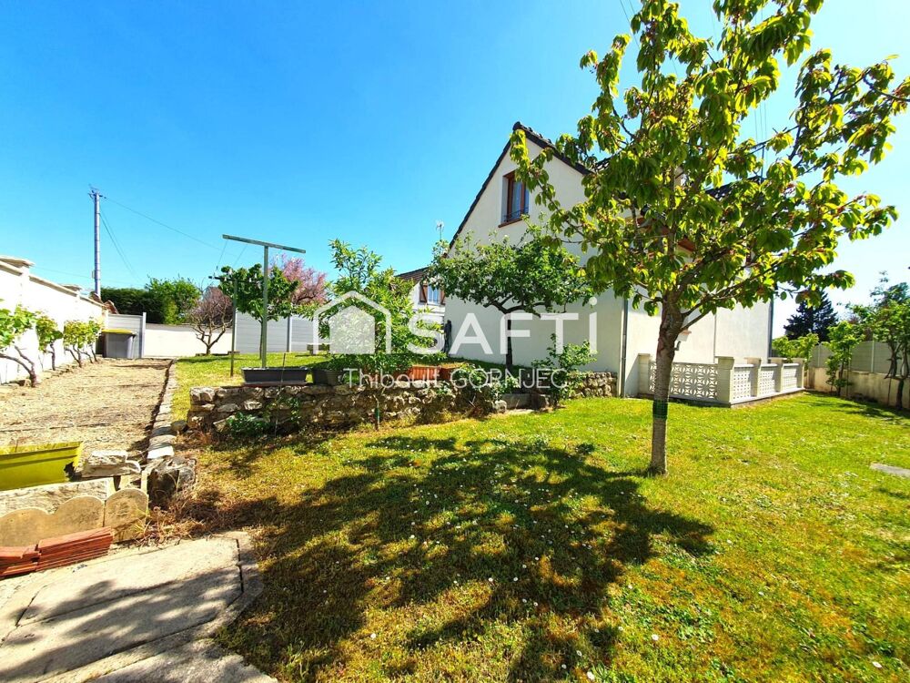 Maison familiale 120 m², 5 chambres, grand jardin avec arbres fruitiers, double garage avec fosse.