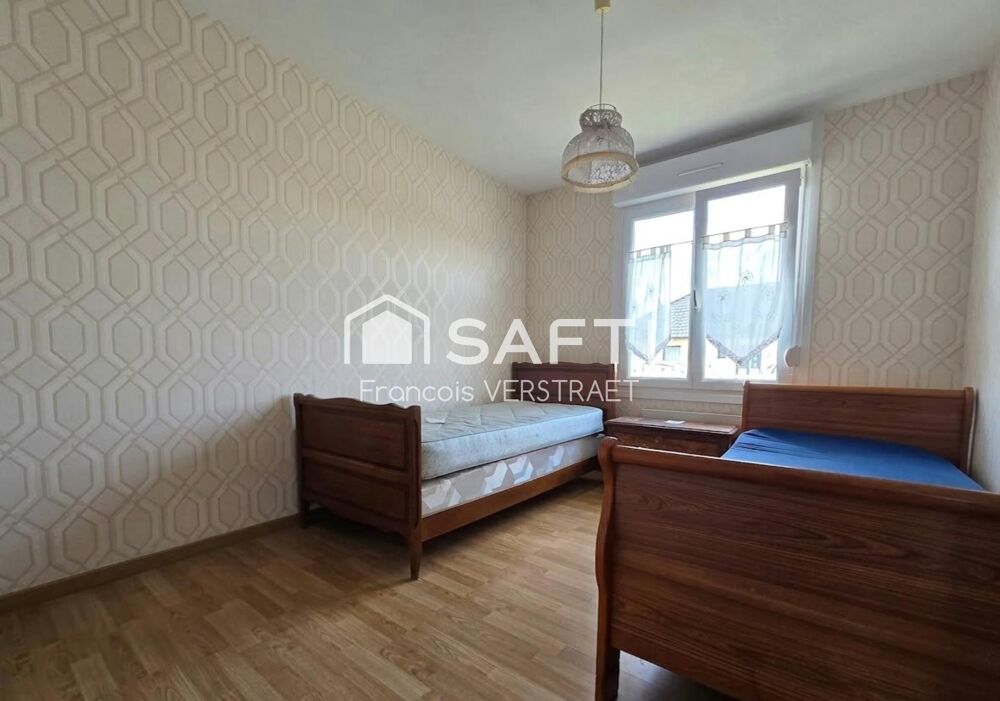 Maison individuelle de plain pied , garage , grand jardin