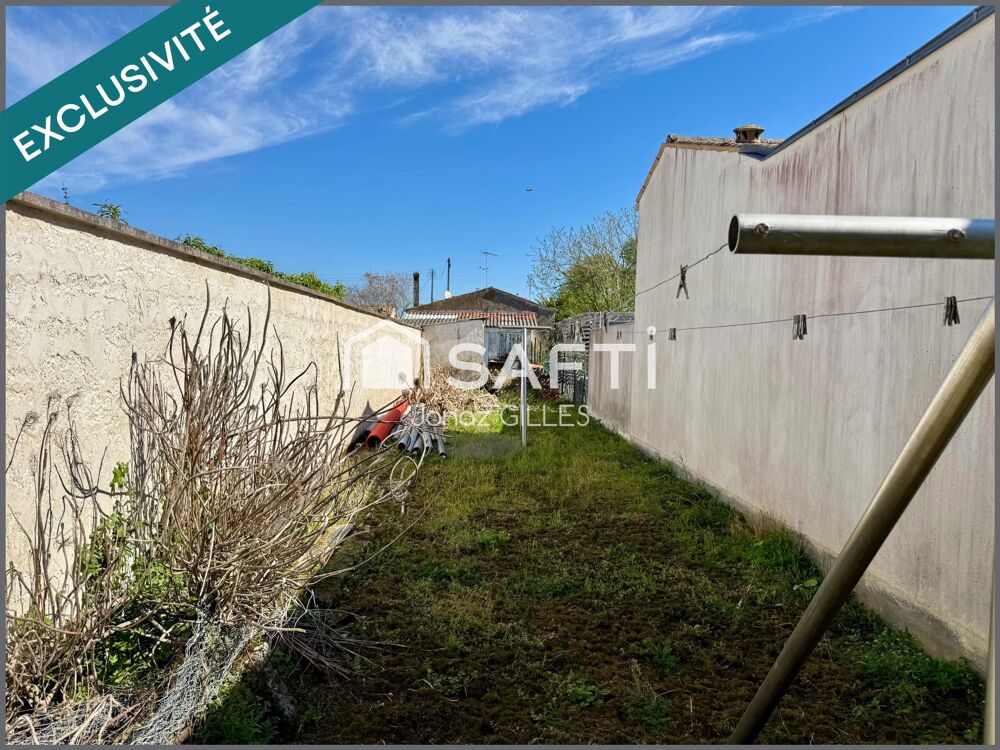 Terrain à bâtir avec bâtiment existant