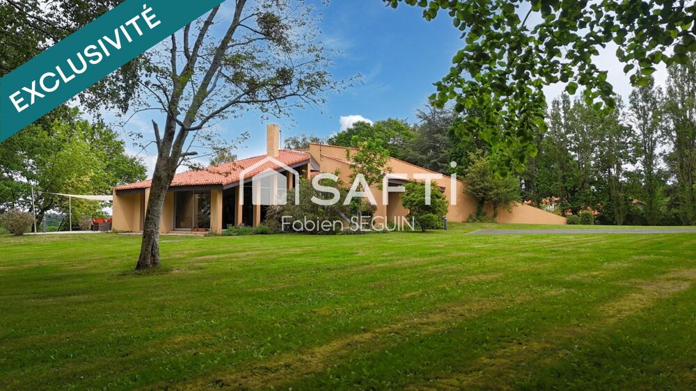 Maison d'architecte de 228 m2 édifiée sur une propriété arborée de 5384 m2 constructible au PLUI