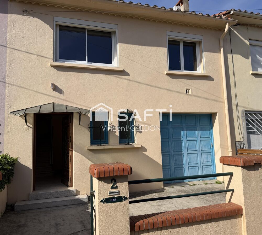 Maison avec garage et jardin clôturé