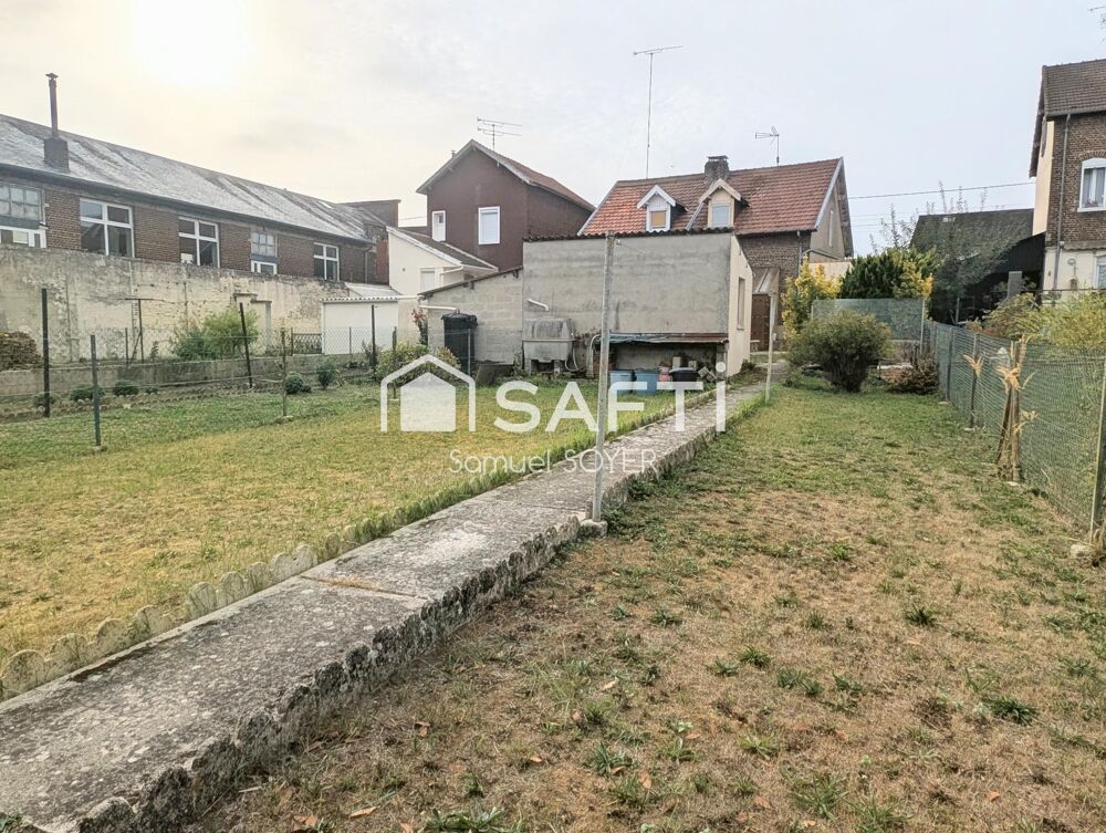 MAISON AVEC GARAGE ET JARDIN PROCHE COMMERCES