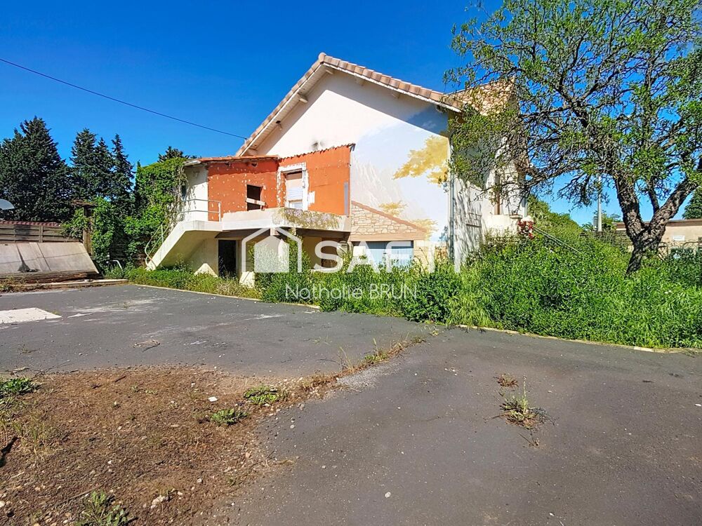 Maison de 87 m² sur 448 m² de terrain, grand garage, activité commerciale
