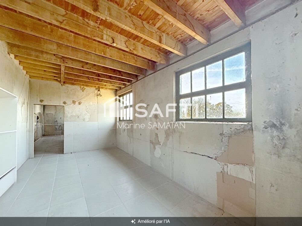 Maison mitoyenne à rénover avec locaux et garage