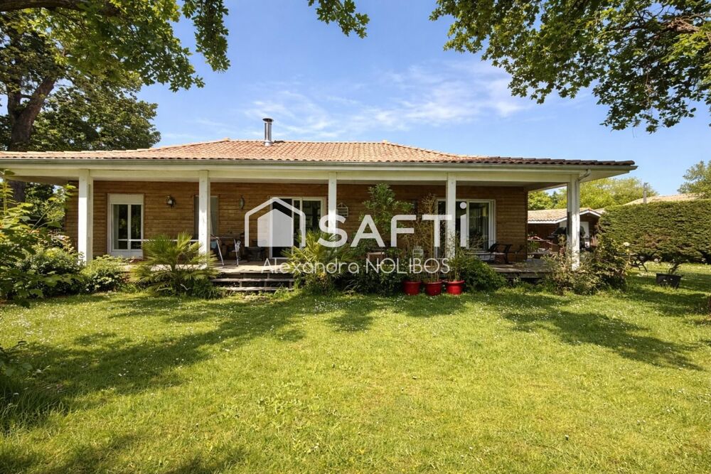 Maison familiale au calme avec un jardin arboré.
