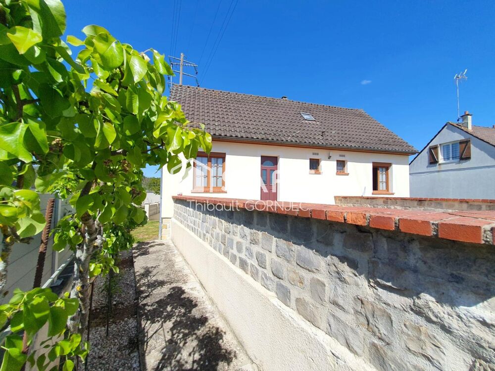 Maison familiale 120 m², 5 chambres, grand jardin avec arbres fruitiers, double garage avec fosse.