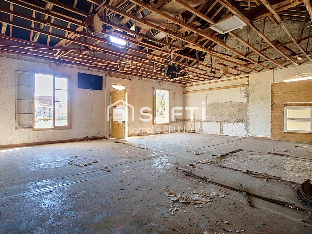 Maison de 87 m² sur 448 m² de terrain, grand garage, activité commerciale