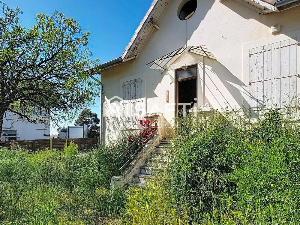 Maison de 87 m² sur 448 m² de terrain, grand garage, activité commerciale