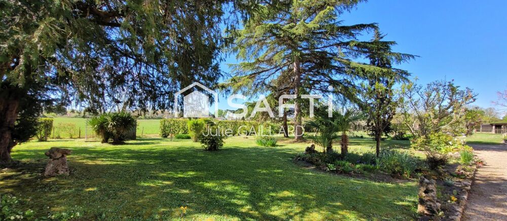 Maison en pierre sur un parc arboré de 4500 m2