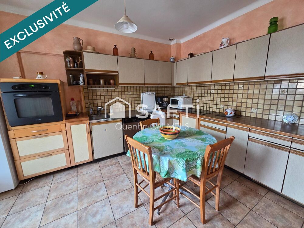 Ensemble immobilier à Nuces , maison de plain-pied et local commercial loué