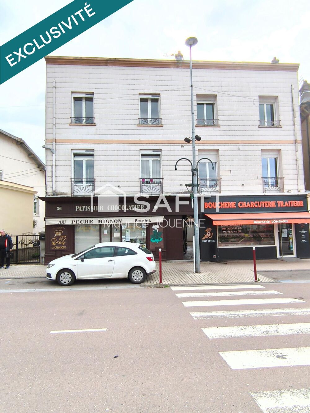   Coeur de VITTEL, bel immeuble mixte incluant un commerce pâtissier, chocolatier et 2 appartements loués 