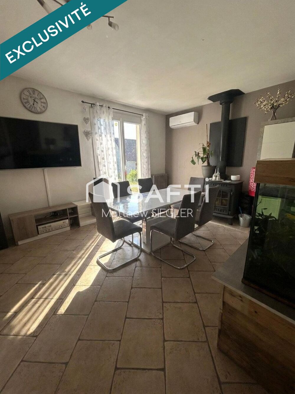 Maison familiale de 116 m² avec 4 chambres, sous-sol complet, terrain arboré de 1 077 m² et équipements énergétiques performants