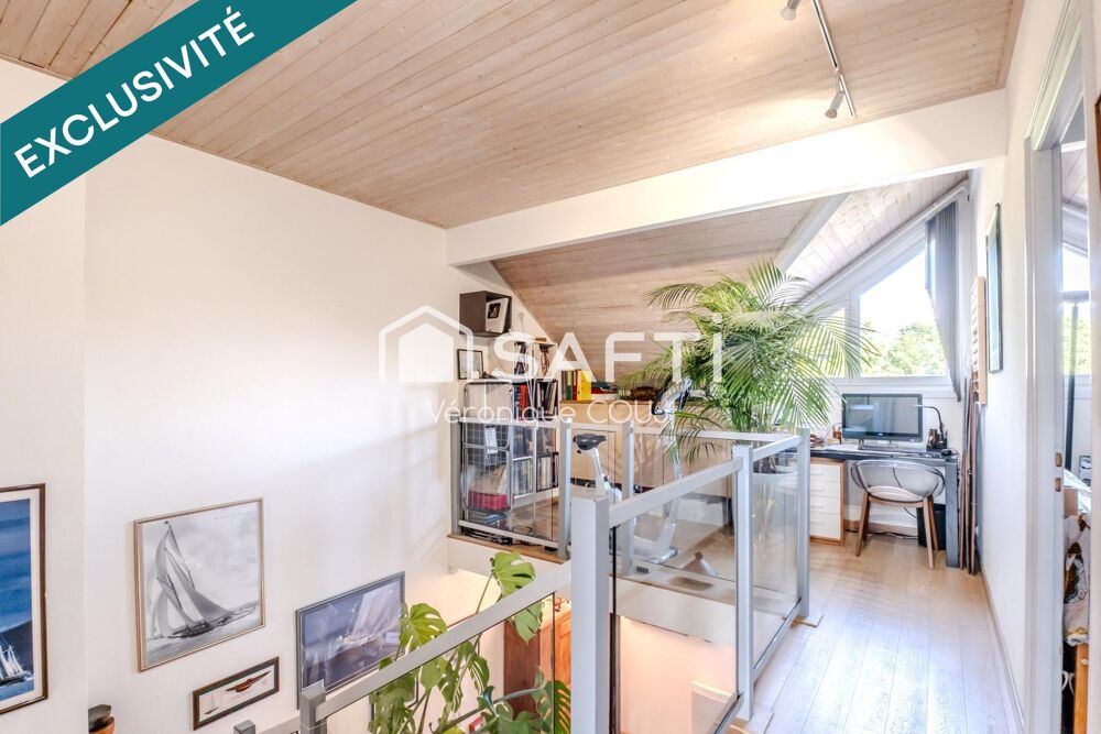 A Veigy-Foncenex (74140), duplex de charme aux beaux volumes avec piscine, à deux pas de la frontière.