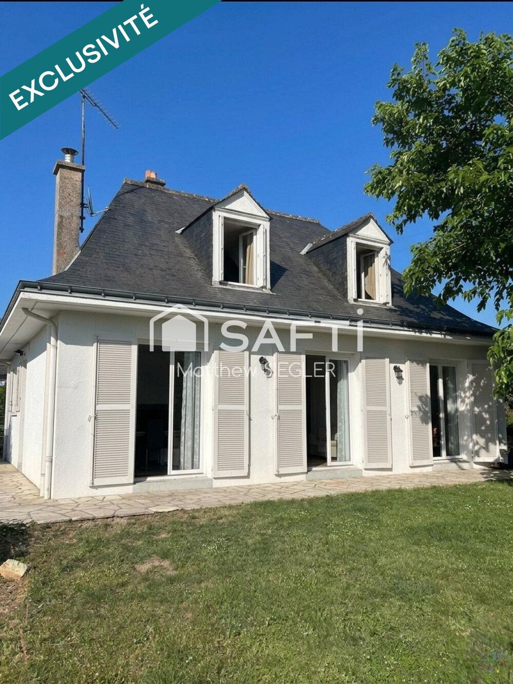Maison familiale de 116 m² avec 4 chambres, sous-sol complet, terrain arboré de 1 077 m² et équipements énergétiques performants