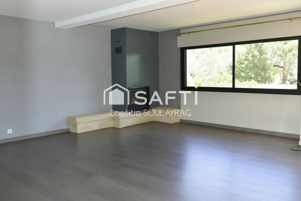 Maison 110 m² avec grand garage et jardin.