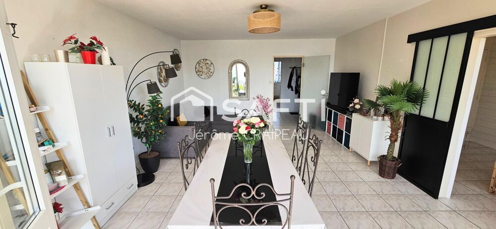 Secteur Gare : Appartement de 98m² avec 3 chambres, balcon, cave et garage.