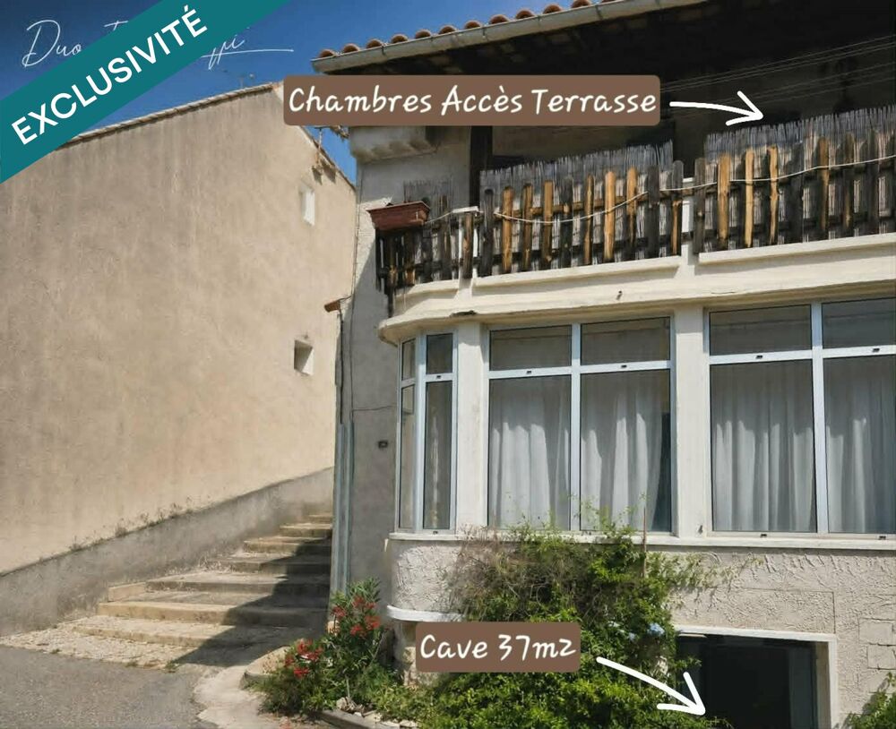 Maison de village avec terrasse, véranda, caves, garage et stationnement.
