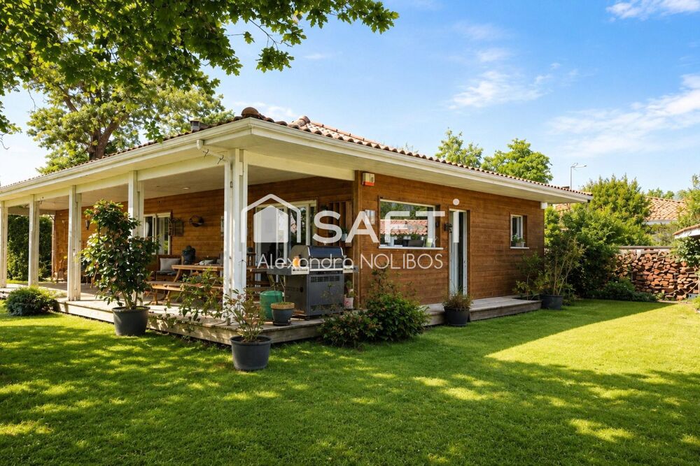 Maison familiale au calme avec un jardin arboré.