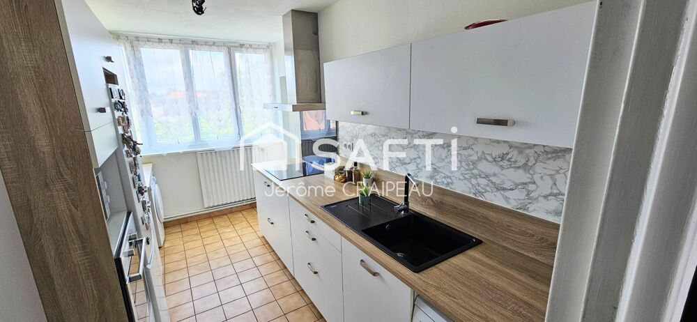 Secteur Gare : Appartement de 98m² avec 3 chambres, balcon, cave et garage.