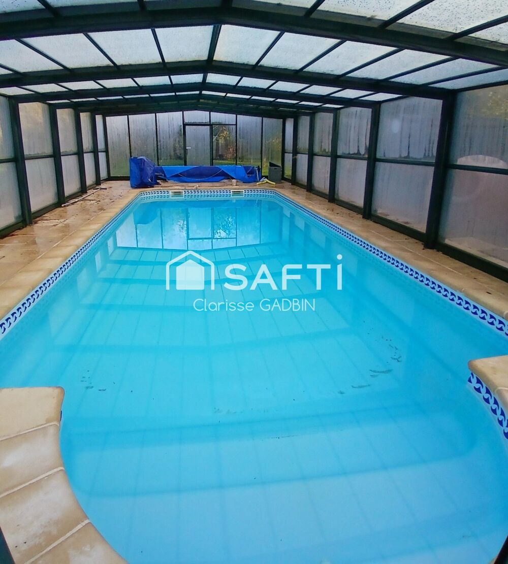 Magnifique propriété avec longère rénovée avec 3 chambres, piscine couverte, 16 hectares de terrain dont bois