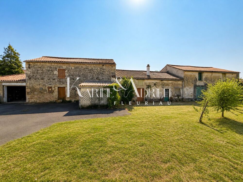 Maison de village avec jardin, garage, cave et seconde maison à rénover