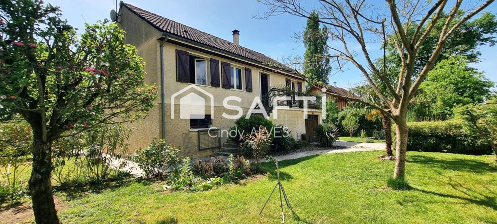 Maison 4 chambres avec sous sol et parc arboré.